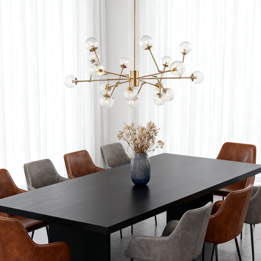 Bubble sputnik chandelier serving as a statement focal point in a crisp white dining room with floor-to-ceiling black frame windows.