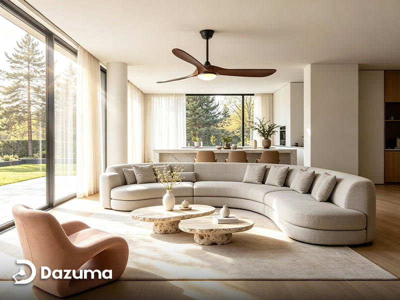 Ceiling fan direction in summer over a bright living room.