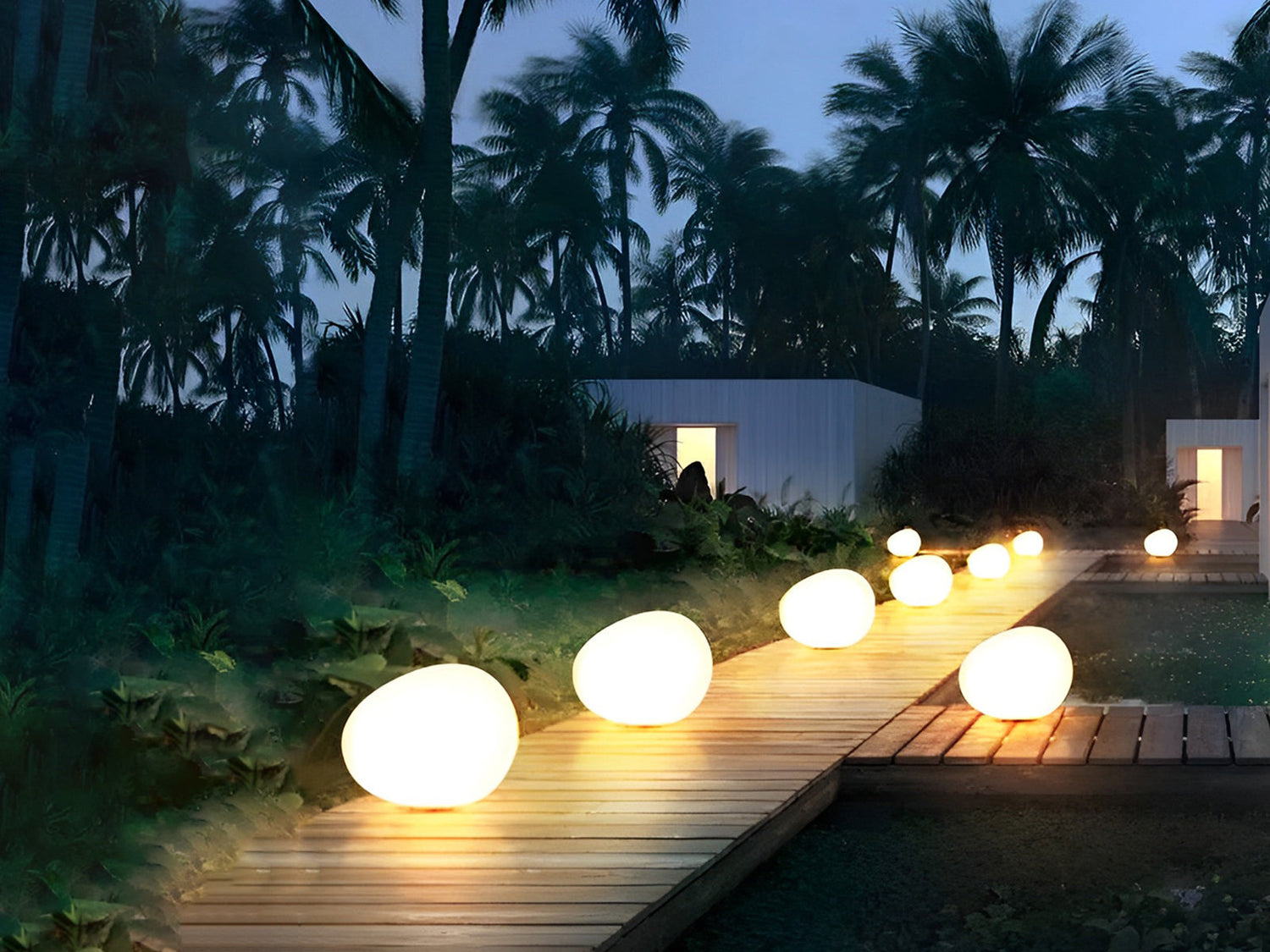 Soft glowing spherical lights lining a garden path.