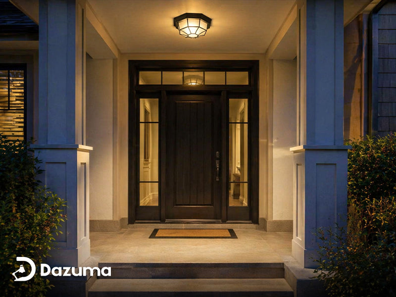 Outdoor ceiling light illuminating a covered porch entry at night.
