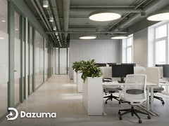 Modern office lighting ideas with LED pendant lights in open workspace.