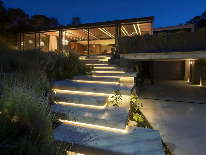 Modern outdoor step lighting installed on concrete stairs, creating a safe and elegant pathway at night.