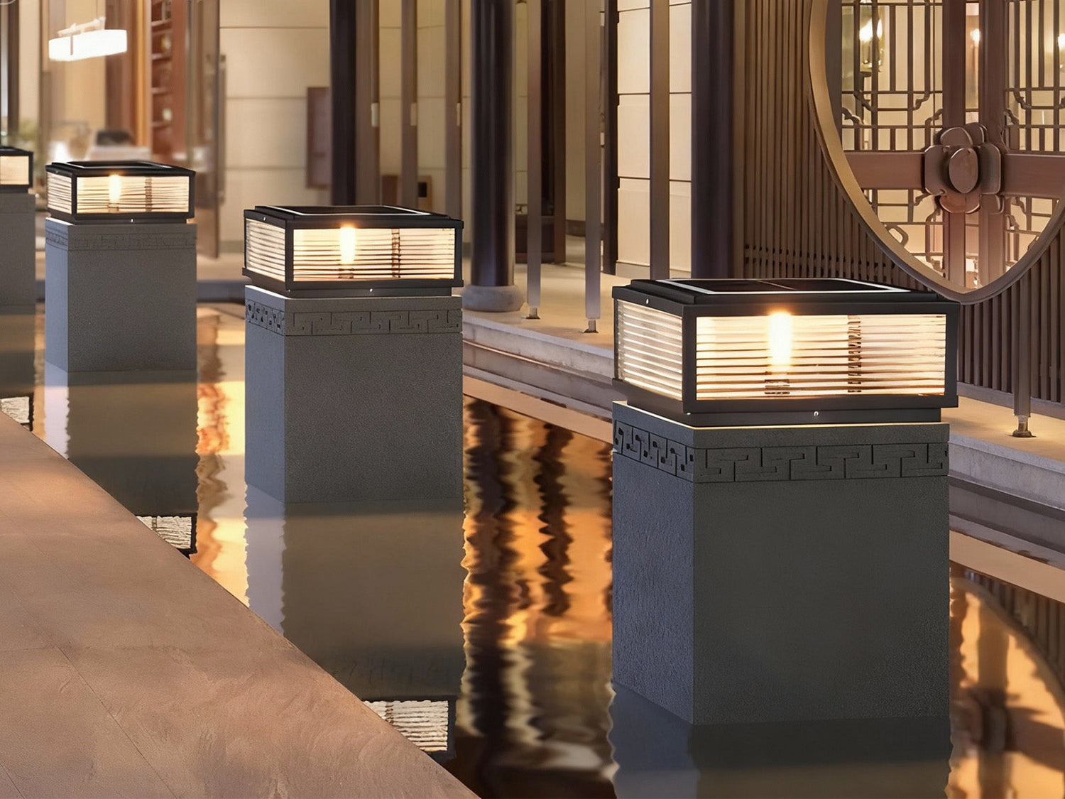 modern pillar light illuminating a waterfront pathway