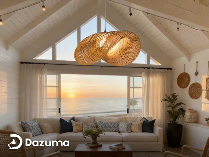 rattan pendant light hanging in a bright coastal style living room with ocean view.