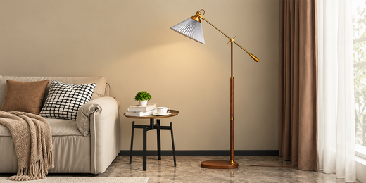 Elegant small black pendant light with premium brass hardware creating perfect reading corner ambiance