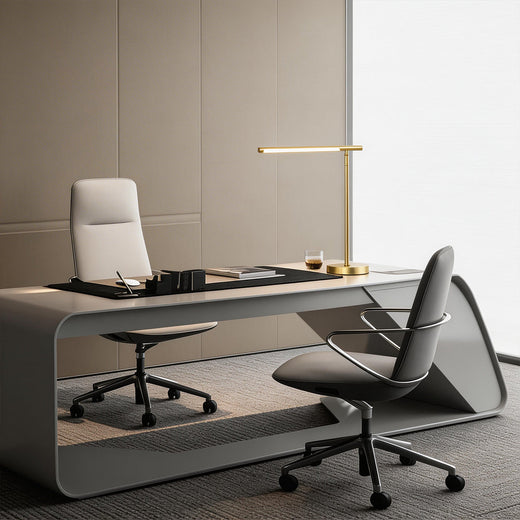 Linear table light with a gold finish, enhancing a contemporary office desk.