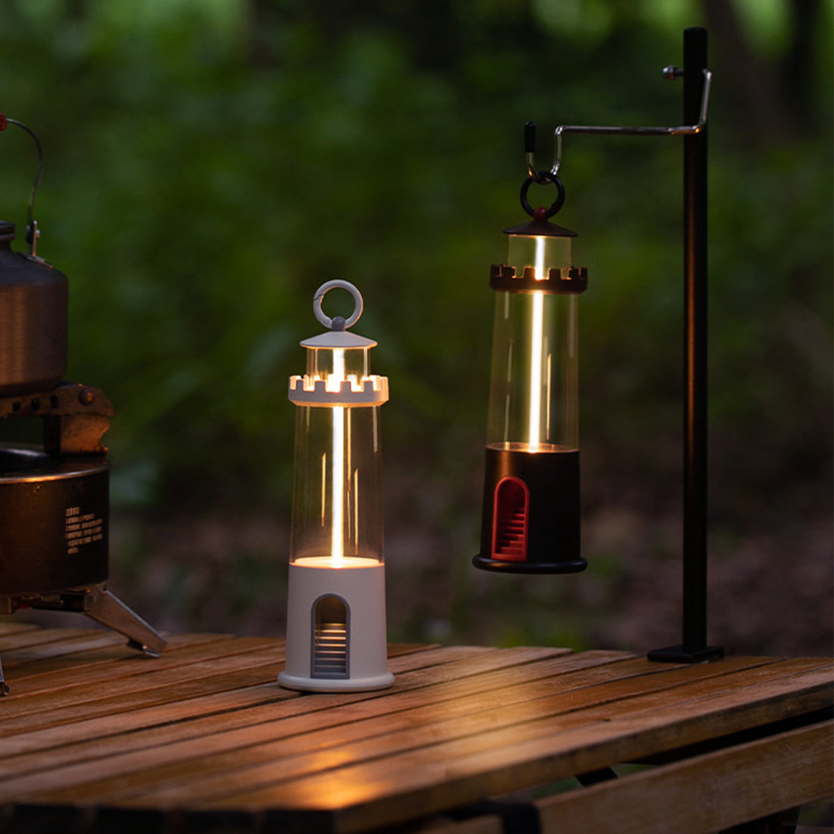 Two vintage-style brass lanterns with glass shades creating atmospheric lighting on wooden surface