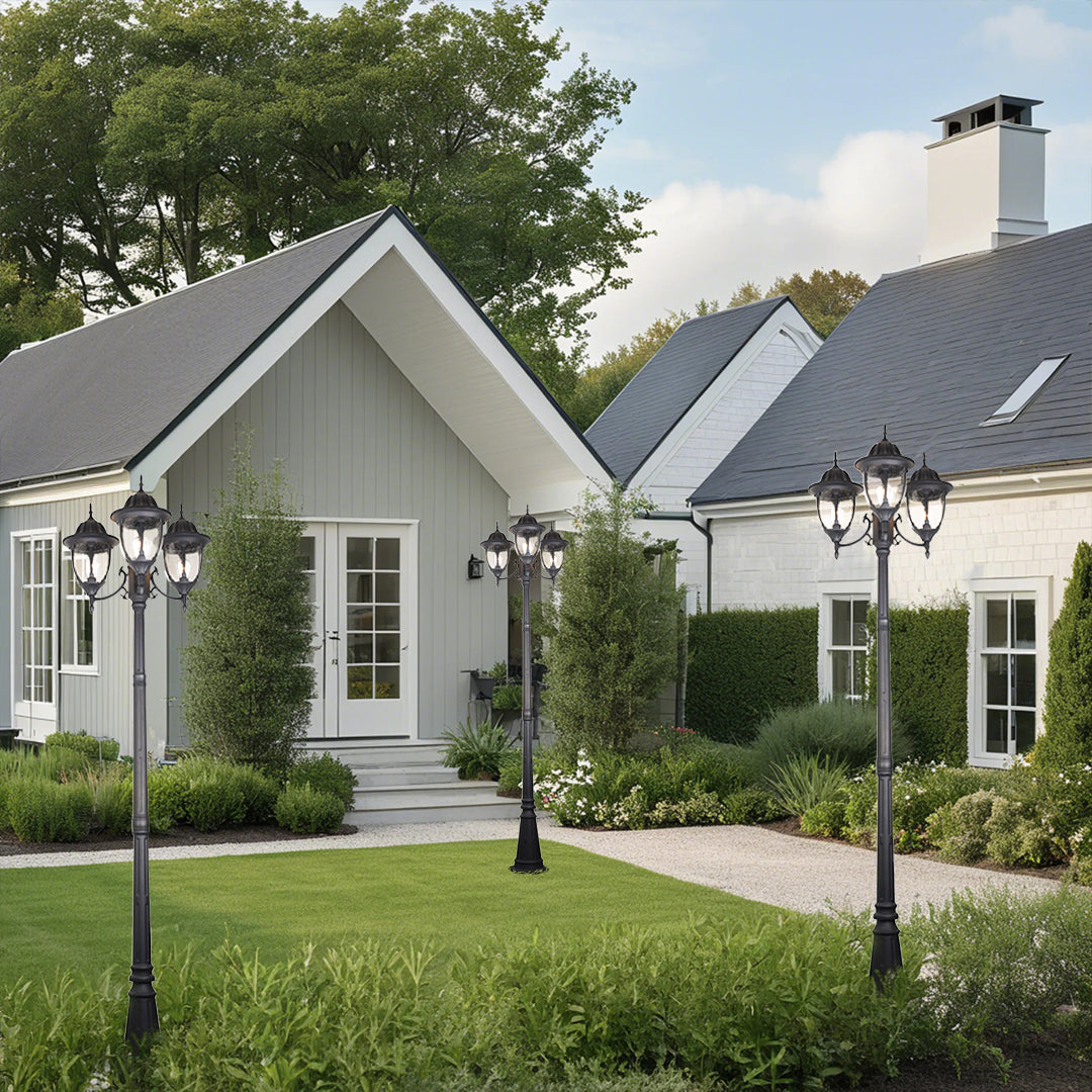 Classic lamppost providing pathway lighting in residential development with white cottage-style homes