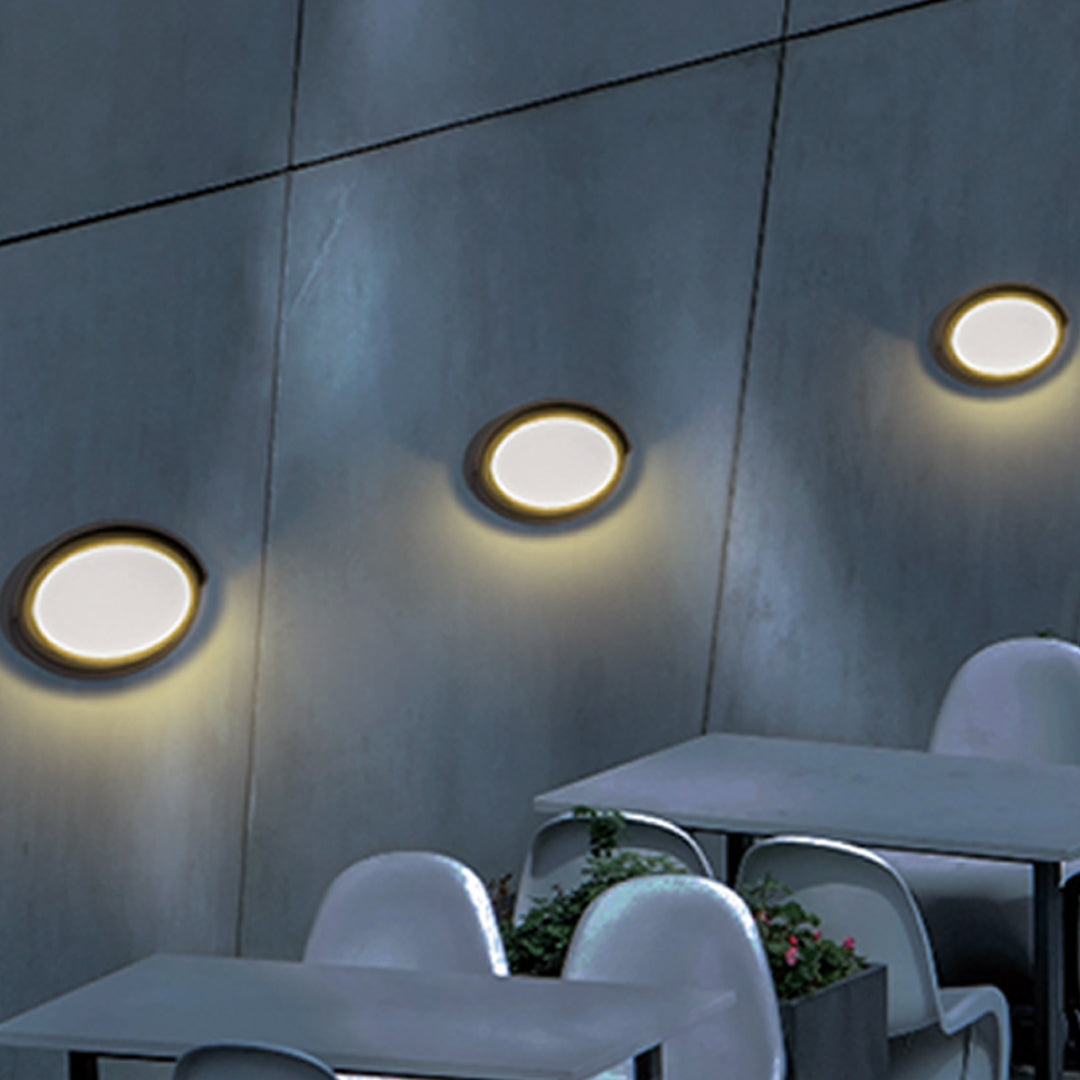 Modern black circular wall light with white LED panel for contemporary interior applications