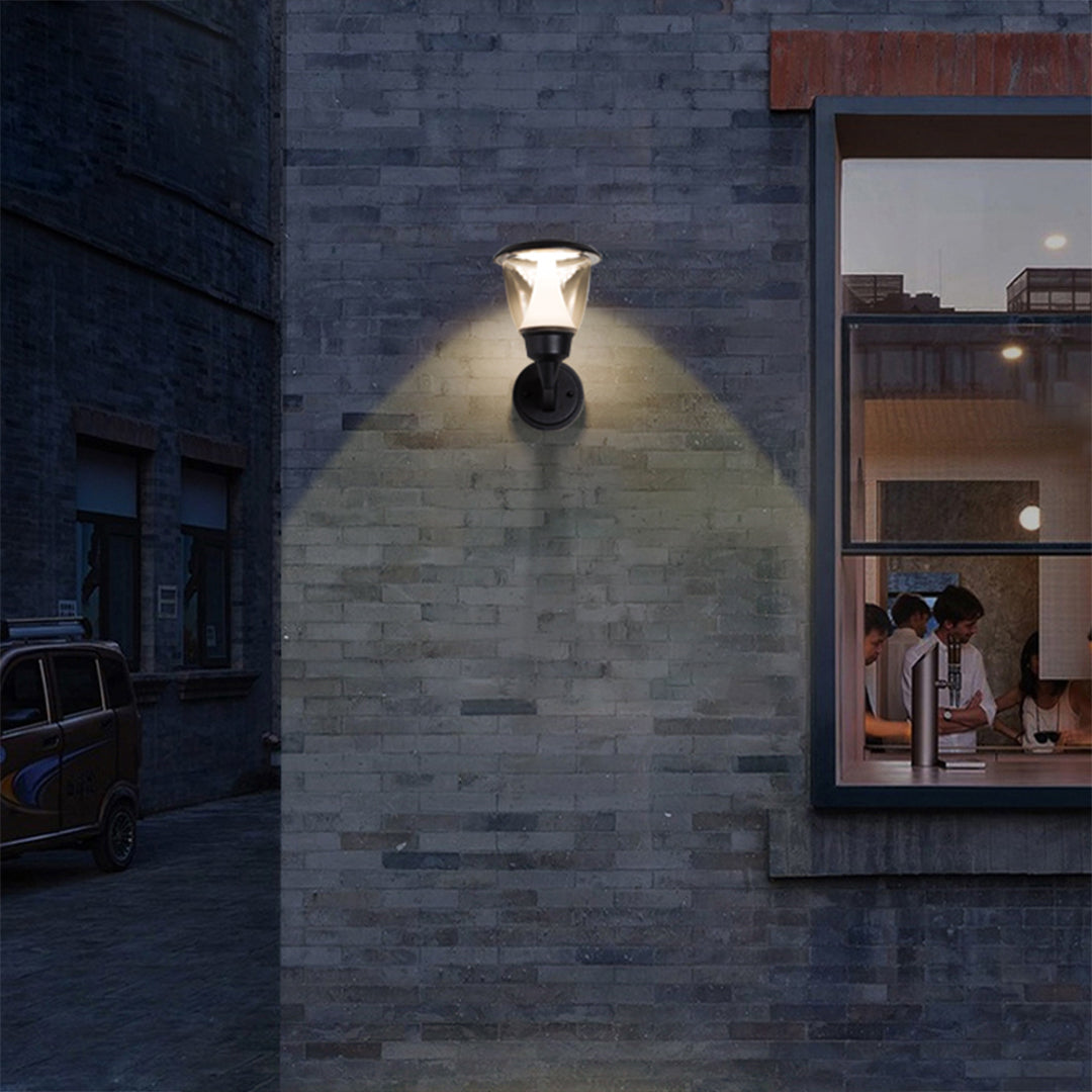 Warm LED wall light illuminating textured brick surface creating dramatic architectural lighting effects