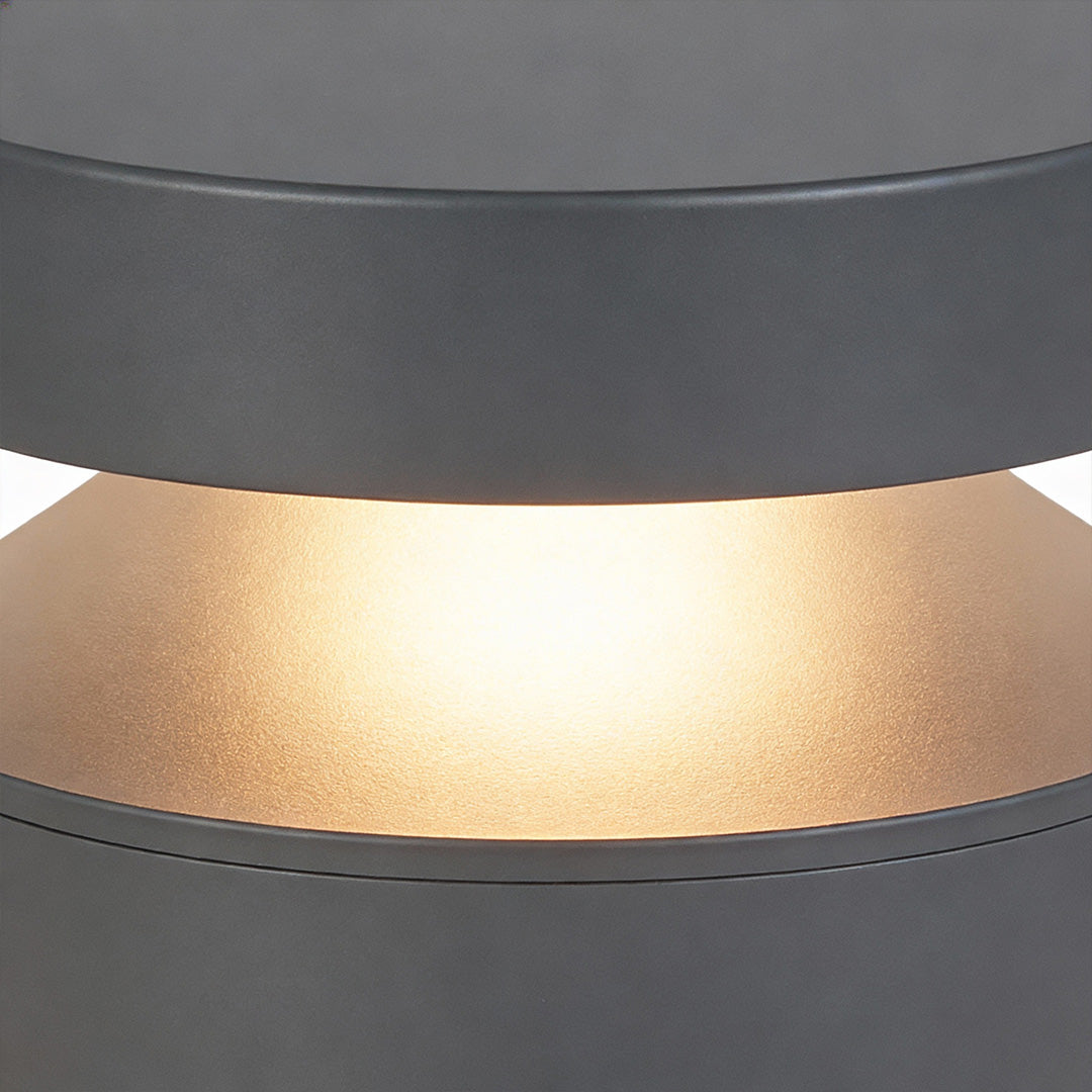 Detailed close-up of the diffuser section on 110v landscape lights, emphasizing warm light output and material texture.