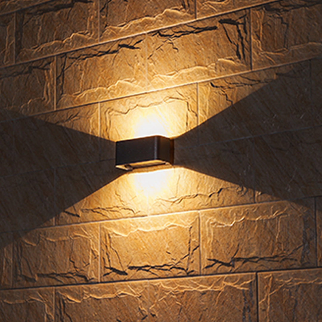 Modern black rectangular LED wall light with integrated sensor and sleek minimalist design