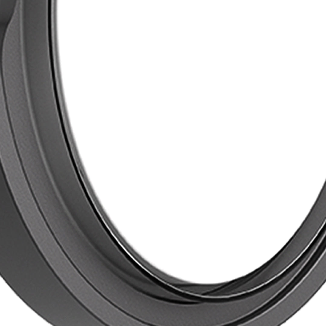 Round outdoor wall sconce with frosted diffuser creating ambient lighting on building exterior