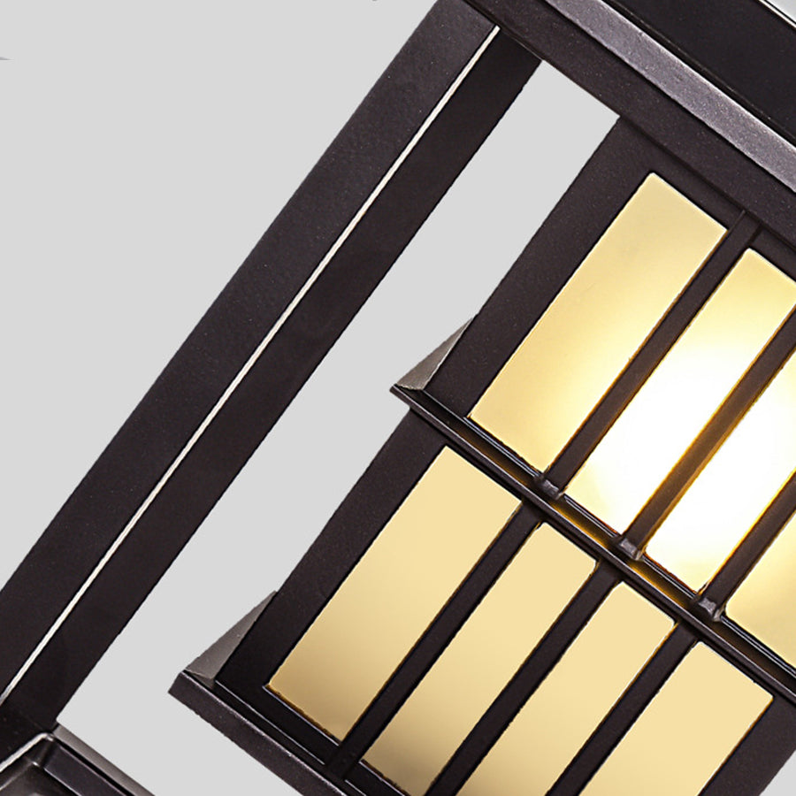 Angled view of contemporary outdoor light showing geometric panel construction and warm glow