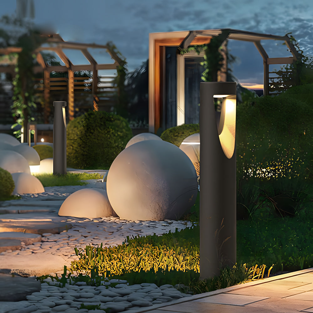 Contemporary outdoor space featuring multiple bollard lights and decorative spherical elements