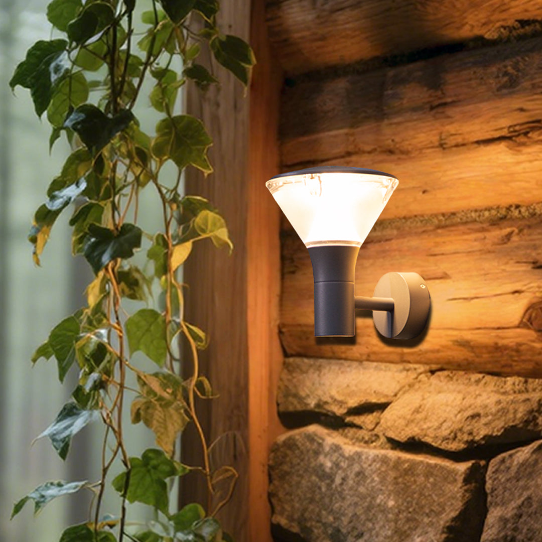 Textured stone wall featuring warm-toned rectangular wall sconce creating atmospheric lighting effects