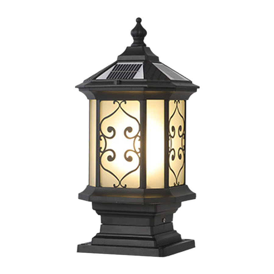 Traditional Asian-inspired post lantern with decorative scrollwork and warm amber glass panels
