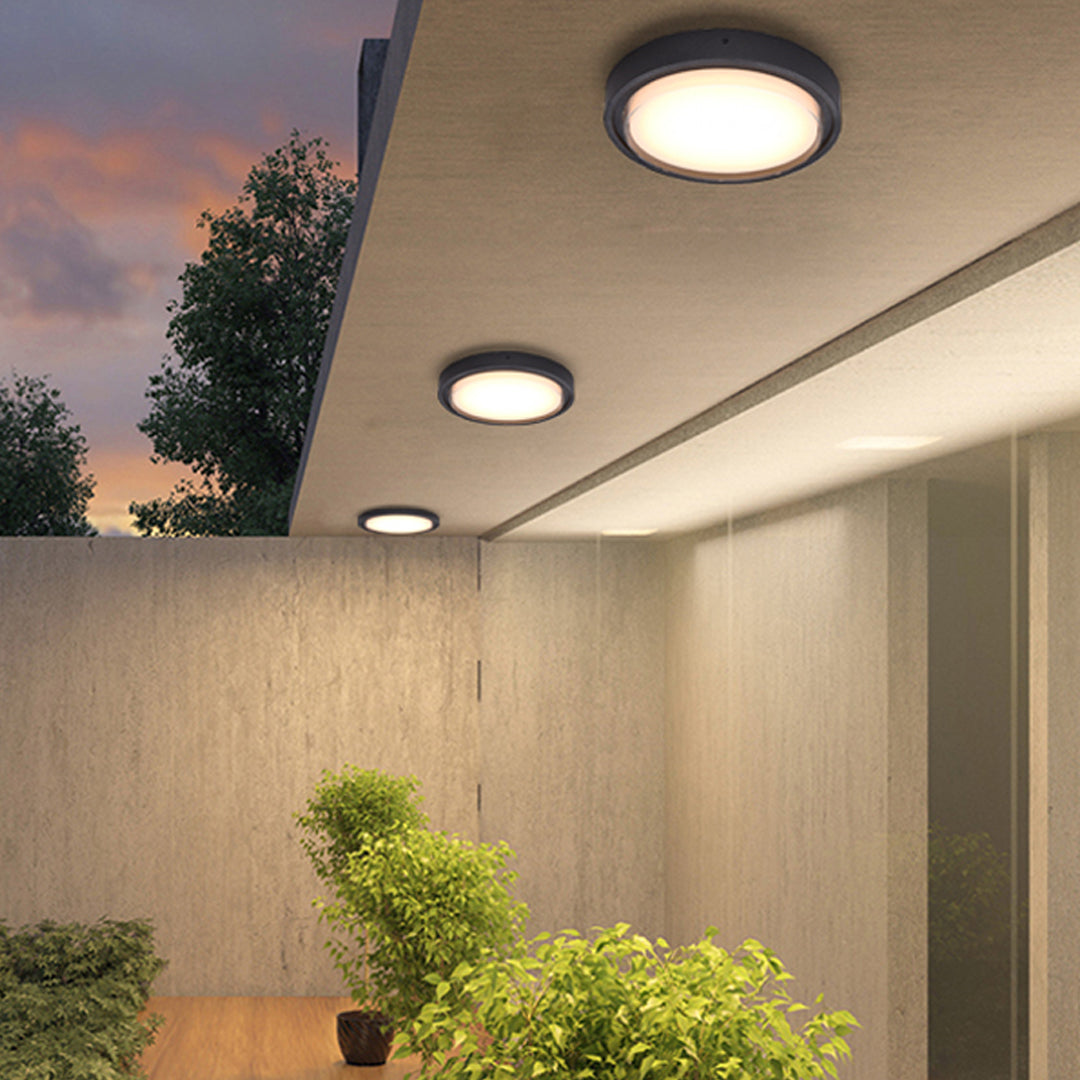 Modern black circular wall light with white LED panel for contemporary interior applications