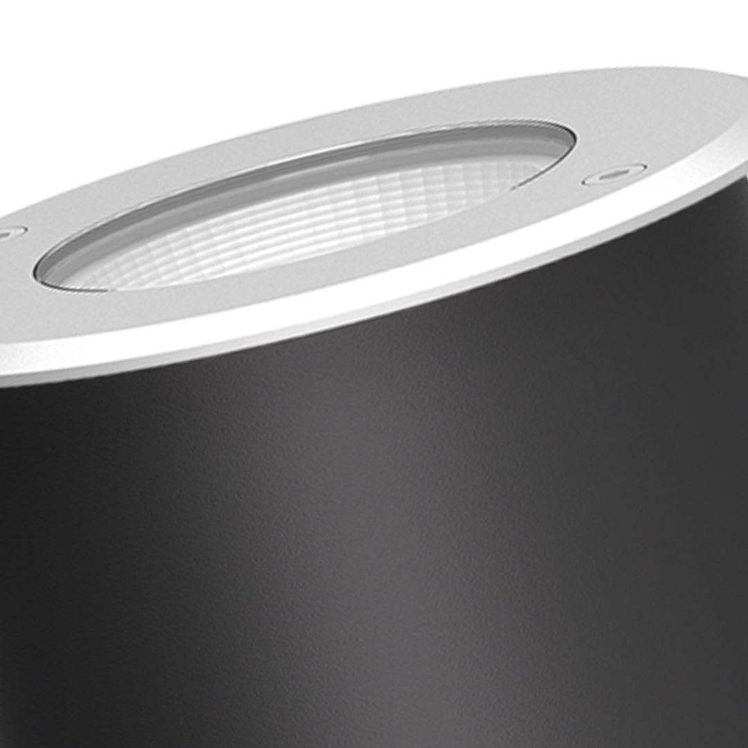 Compact round in-ground fixture with LED array and weather-resistant design for pathway illumination