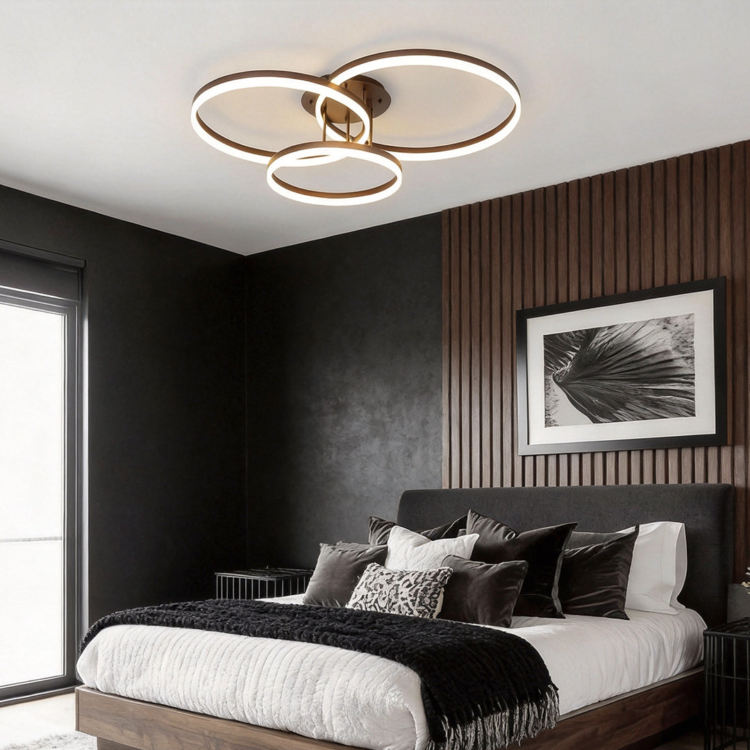 3-ring flush mount illuminating a modern bedroom with warm, ambient glow.