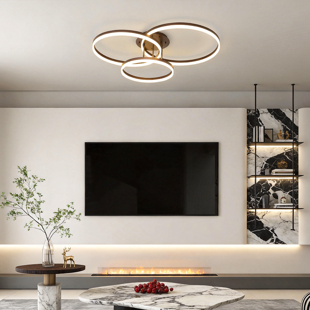 3-ring flush mount providing soft light above a contemporary living room.
