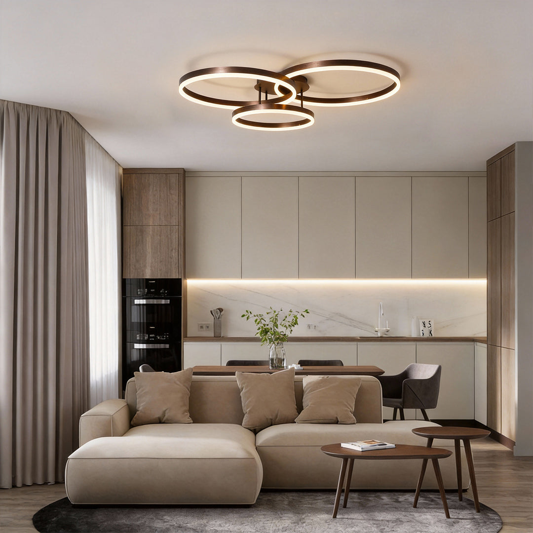 3 ring LED ceiling light illuminating a modern living room with warm, ambient glow.