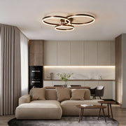 3 ring LED ceiling light illuminating a modern living room with warm, ambient glow.