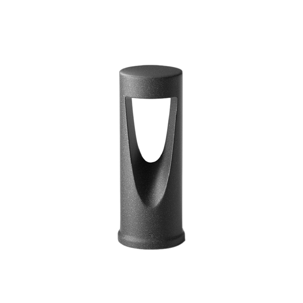 Dark cylindrical bollard light with distinctive oval cutout opening for directional illumination