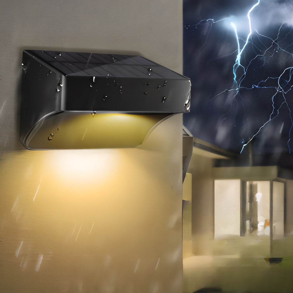 Contemporary wall-mounted LED fixture creating dramatic downward lighting effect during stormy evening atmosphere