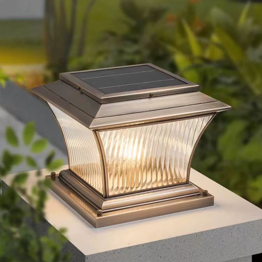 Vintage-style post cap light creating warm ambient lighting in evening garden setting