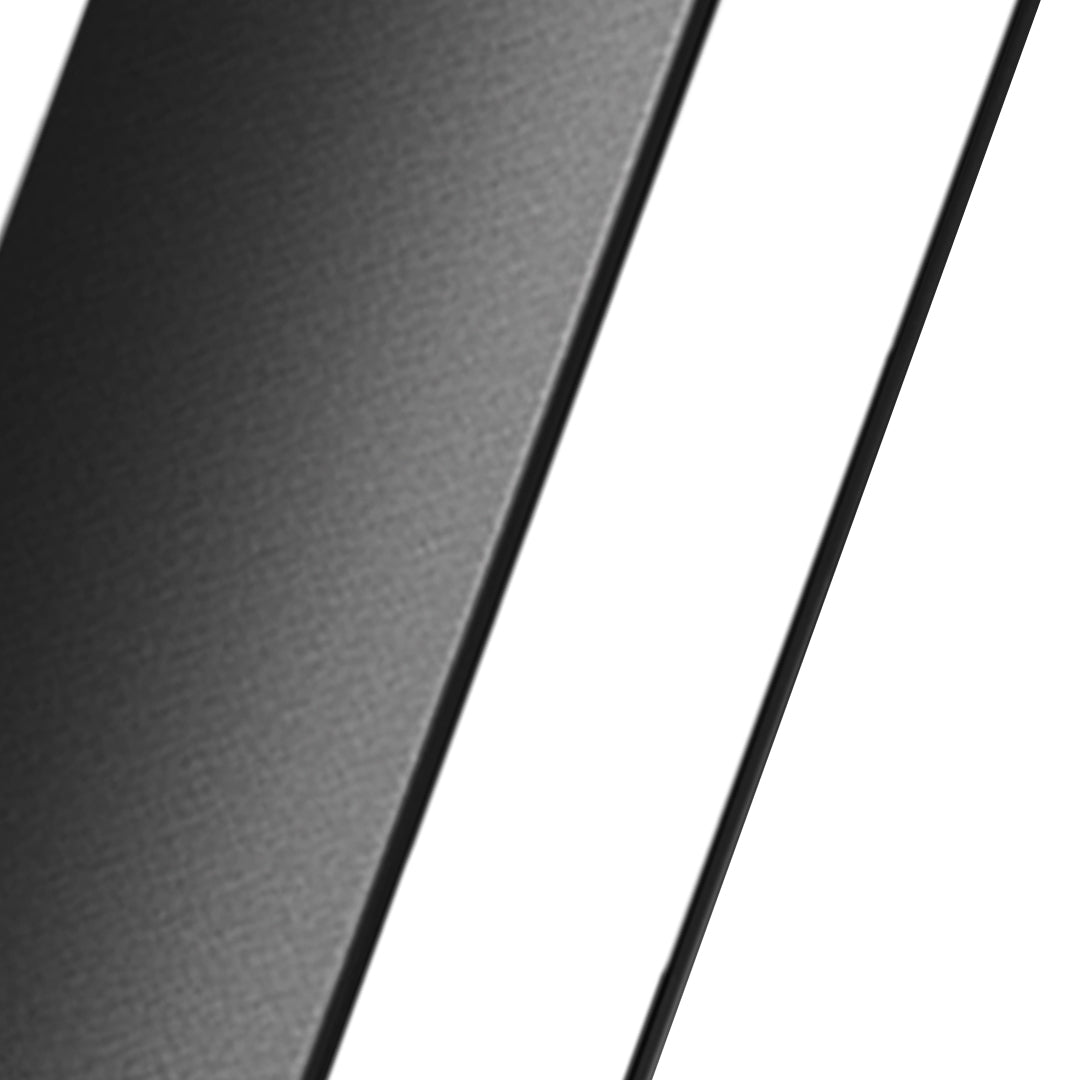 Outdoor wall light casting warm golden glow on brick surface with dramatic shadow effects