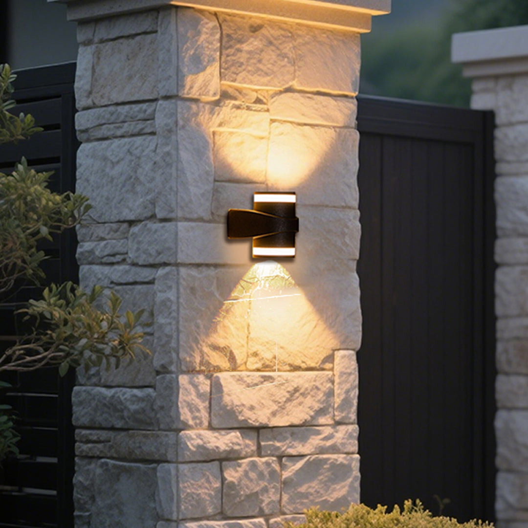 Modern black curved outdoor wall light with integrated LED and sleek geometric design
