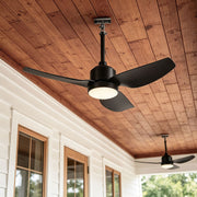 42 inch black ceiling fan with light installed on a covered porch with a warm wood plank ceiling.
