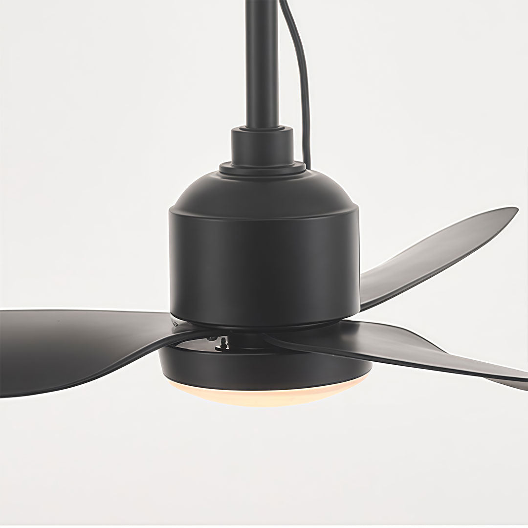 Close-up of a 42 inch black ceiling fan with light featuring a matte black motor and three curved blades.