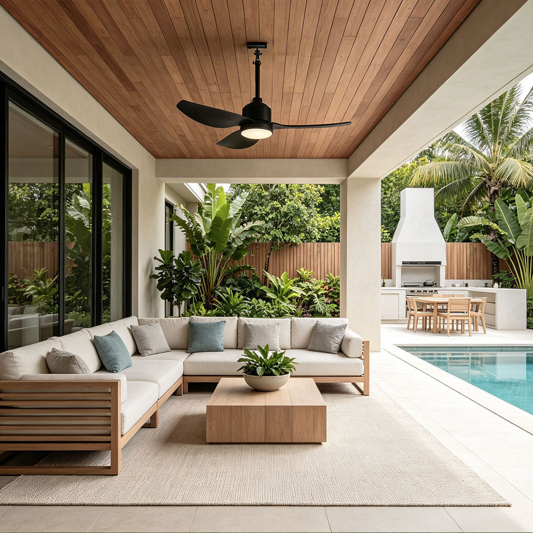 42 inch black ceiling fan with light mounted above a poolside patio with contemporary outdoor seating.