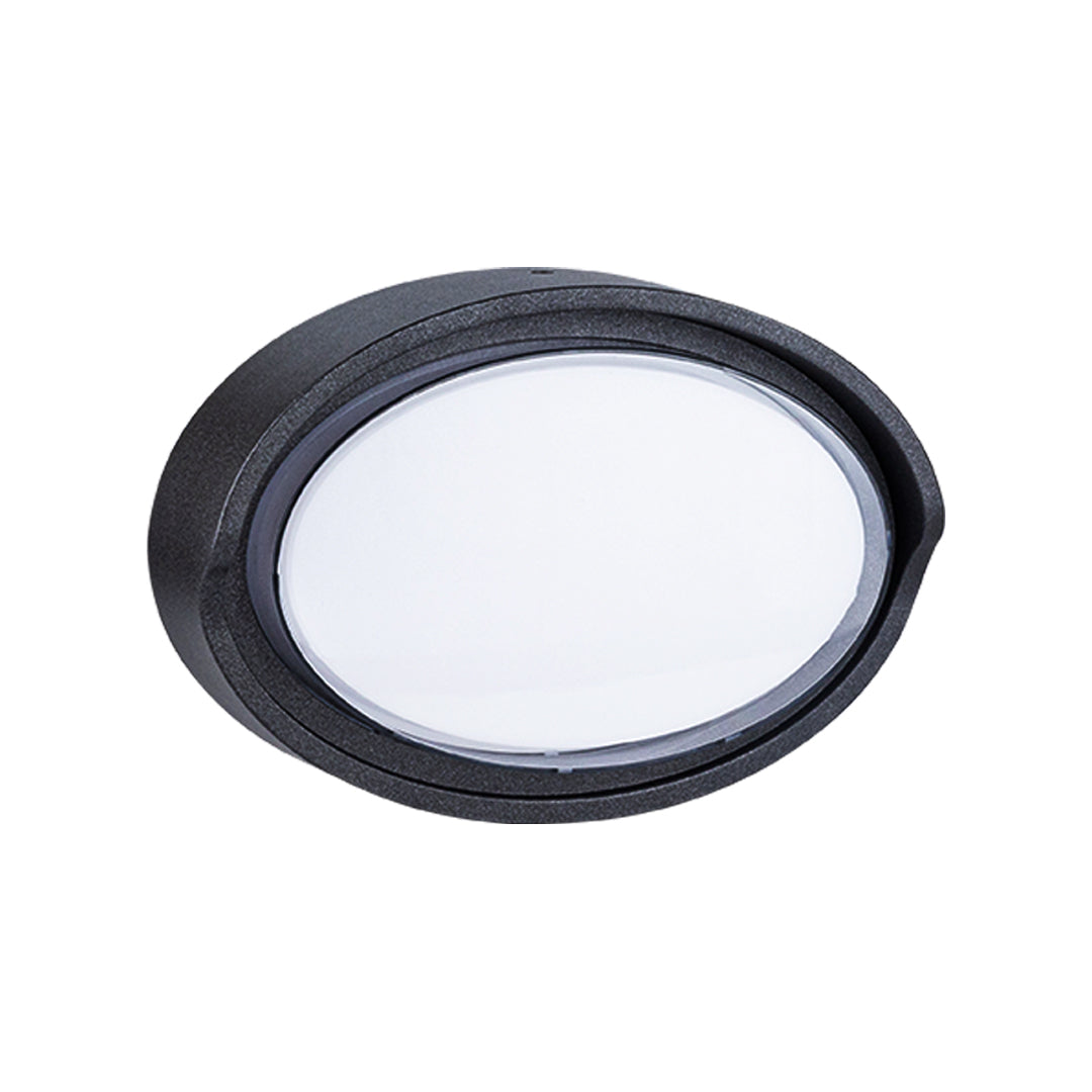 Round outdoor wall sconce with frosted diffuser creating ambient lighting on building exterior