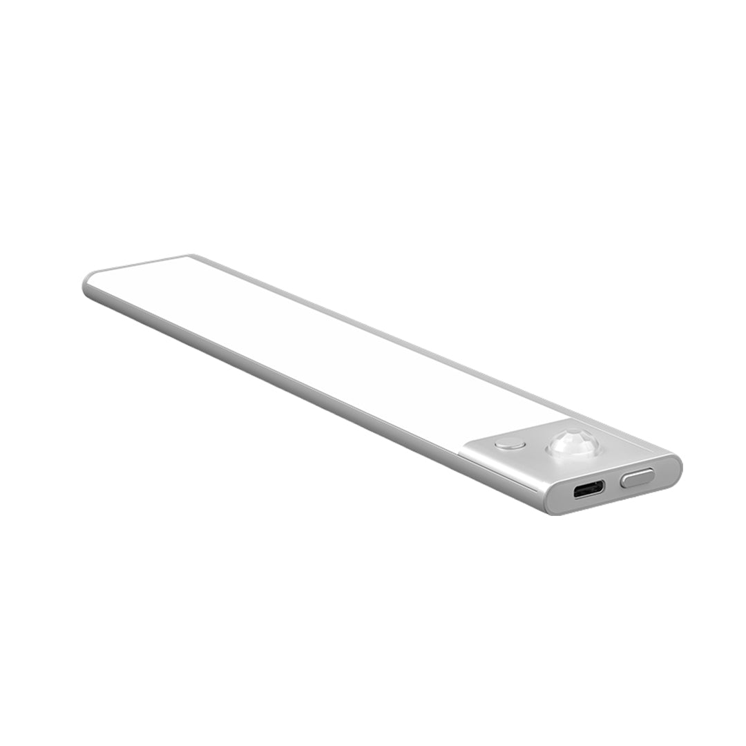 Slim LED strip light mounted under cabinet shelf providing bright white illumination in modern kitchen setting