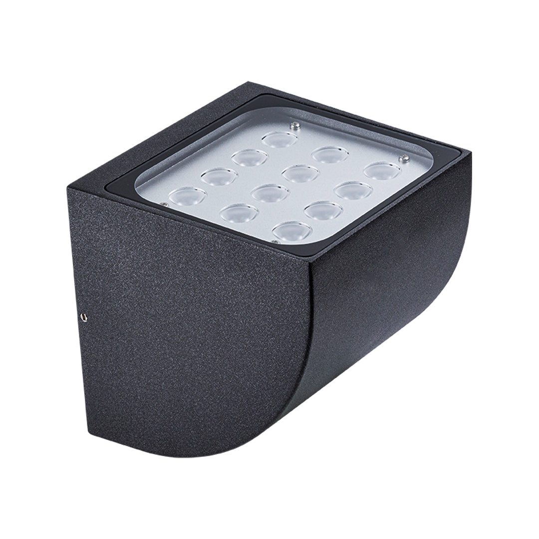 Close-up view of bronze outdoor light fixture showing curved arm and mounting details