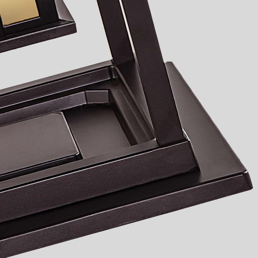 Detail shot of precision-engineered lamp mounting system with dark bronze finish