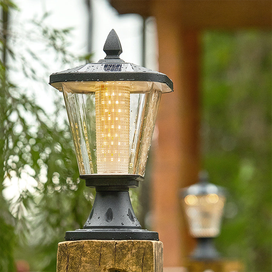 Multiple solar post lights creating warm pathway lighting in residential outdoor setting