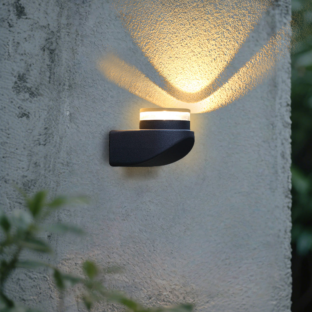 Modern black curved outdoor wall light with integrated LED and sleek geometric design