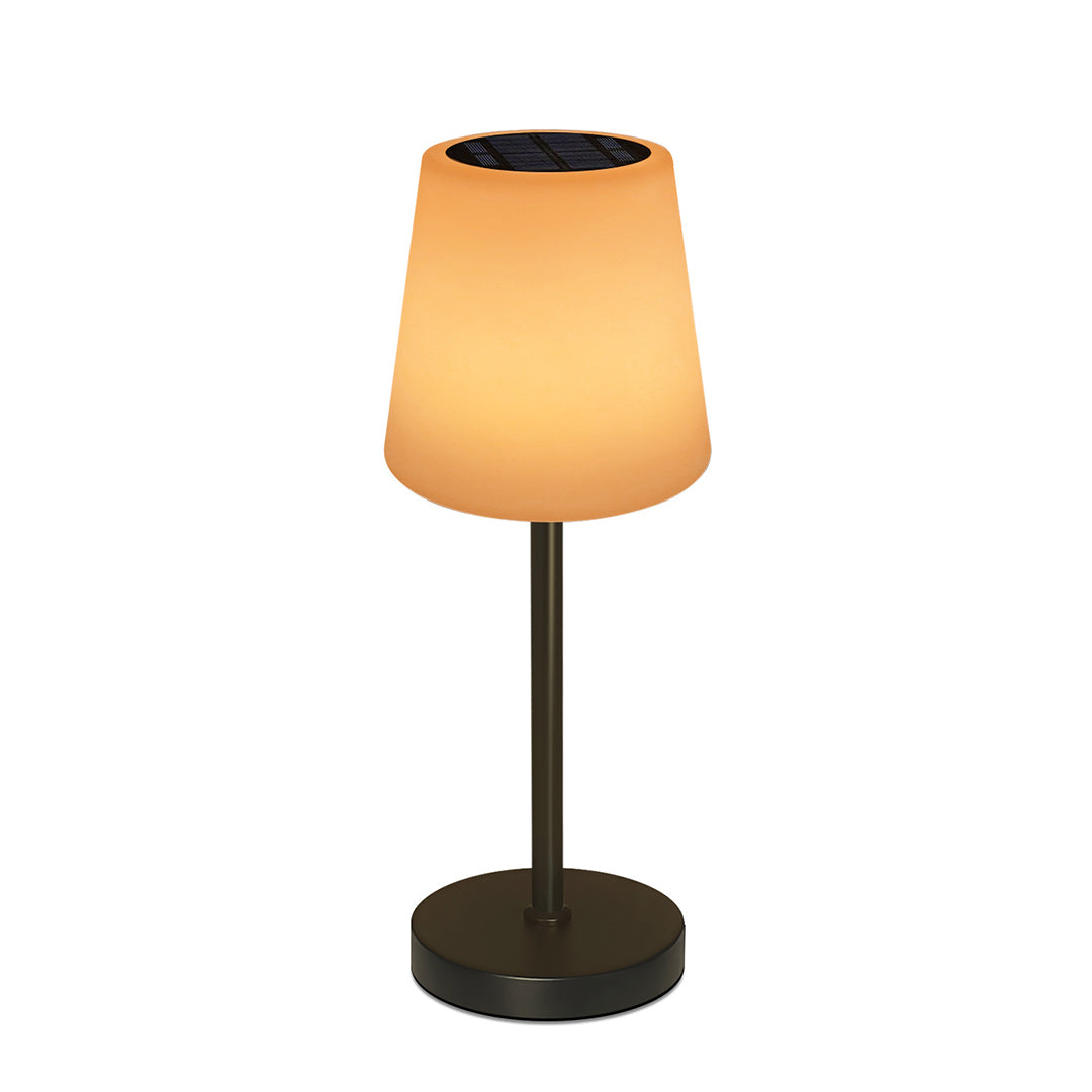 Cordless LED table lamp with warm amber shade and black stem against clean white background
