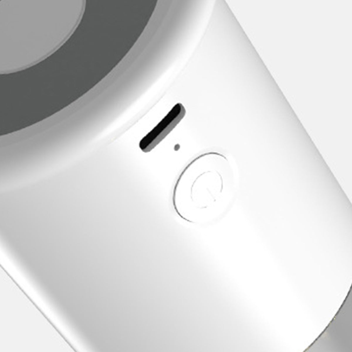 Close-up of white circular control dial with black accent line on modern appliance