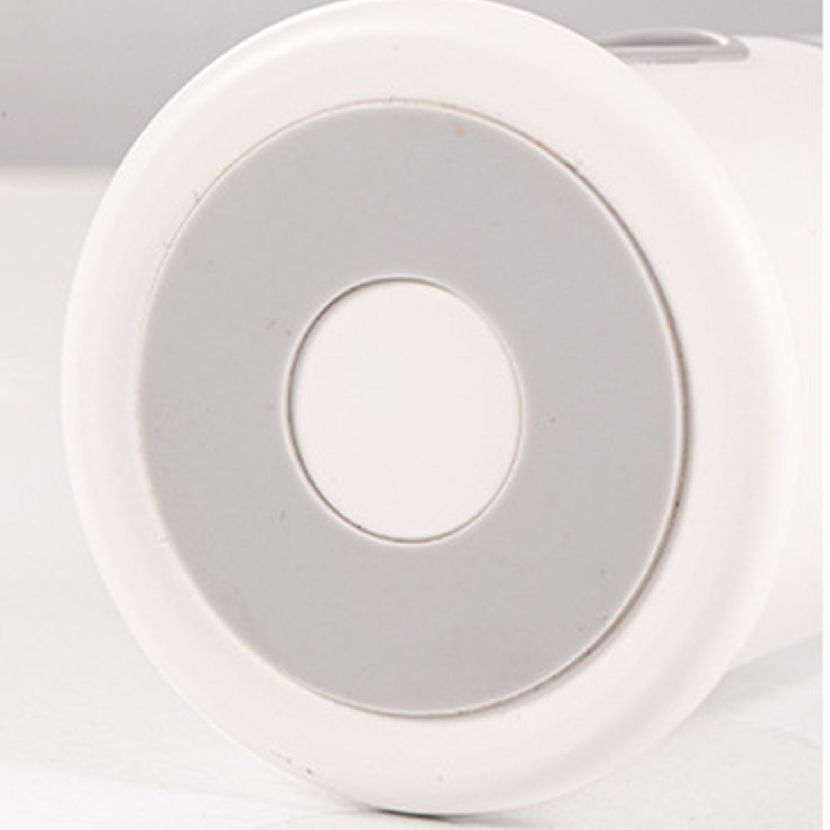 Modern white circular ceiling light fixture with clean minimalist design and recessed installation