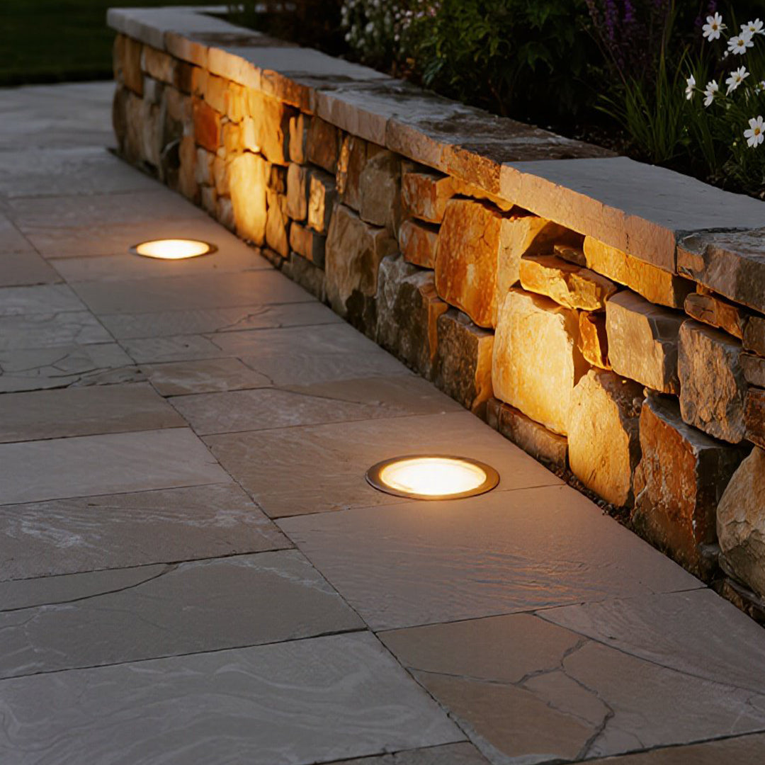 Compact round in-ground fixture with LED array and weather-resistant design for pathway illumination