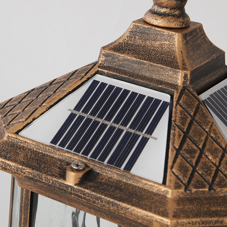 Contemporary outdoor lantern with warm LED lighting positioned on modern wooden deck