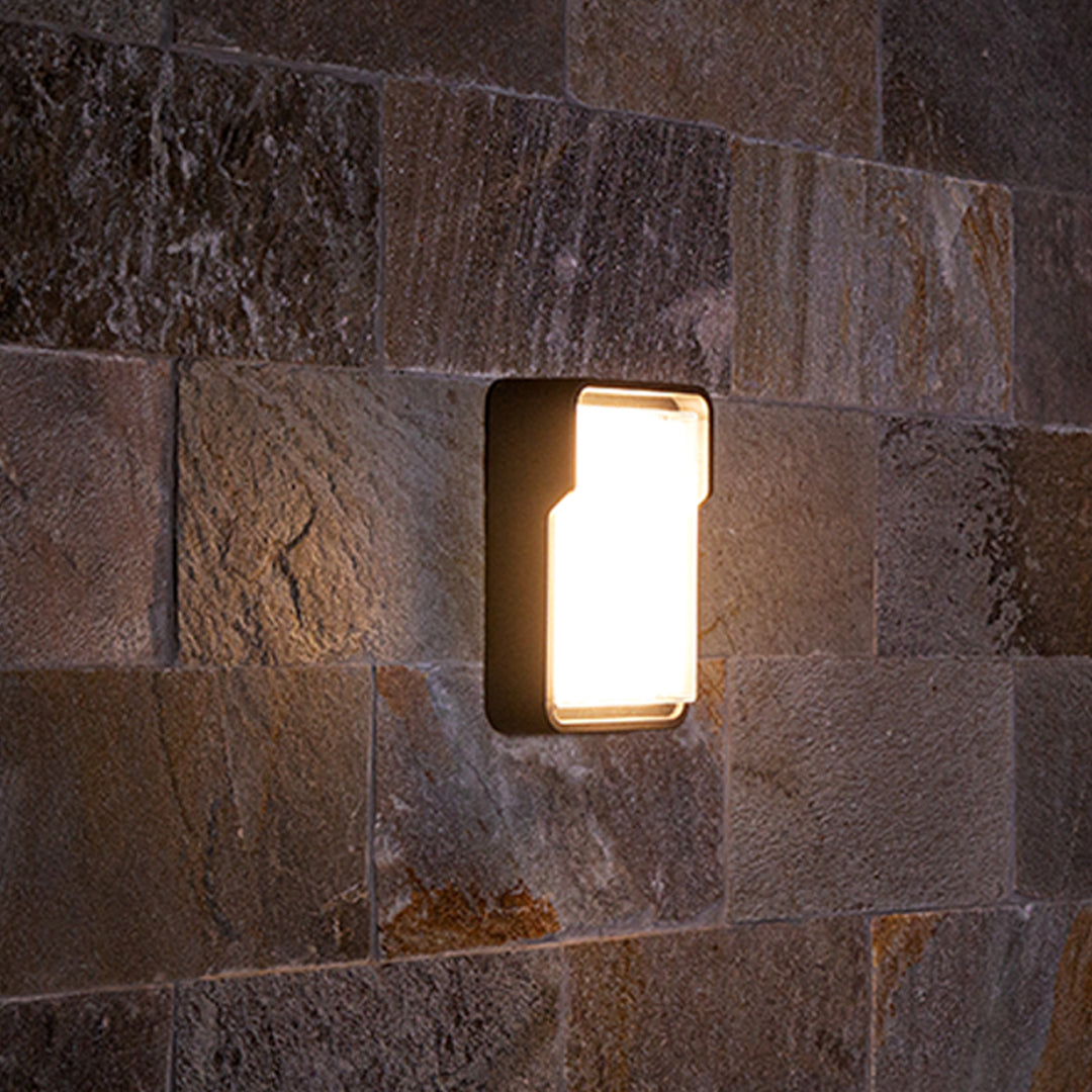 Cylindrical white wall light with clean modern design for minimalist architectural applications