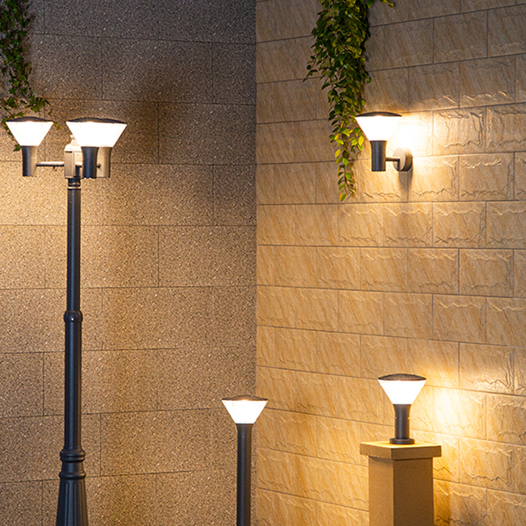 Industrial-style black cylindrical outdoor light fixture with robust weather-resistant construction