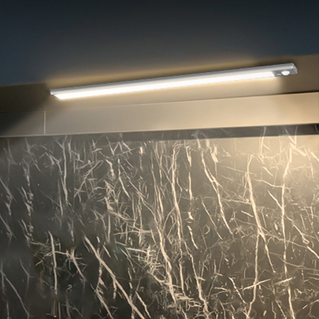 Under-counter LED strip providing bright workspace illumination with marble backsplash accent