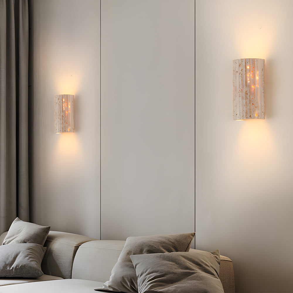 Contemporary bedroom interior with coordinated stone sconces providing soft accent lighting throughout space